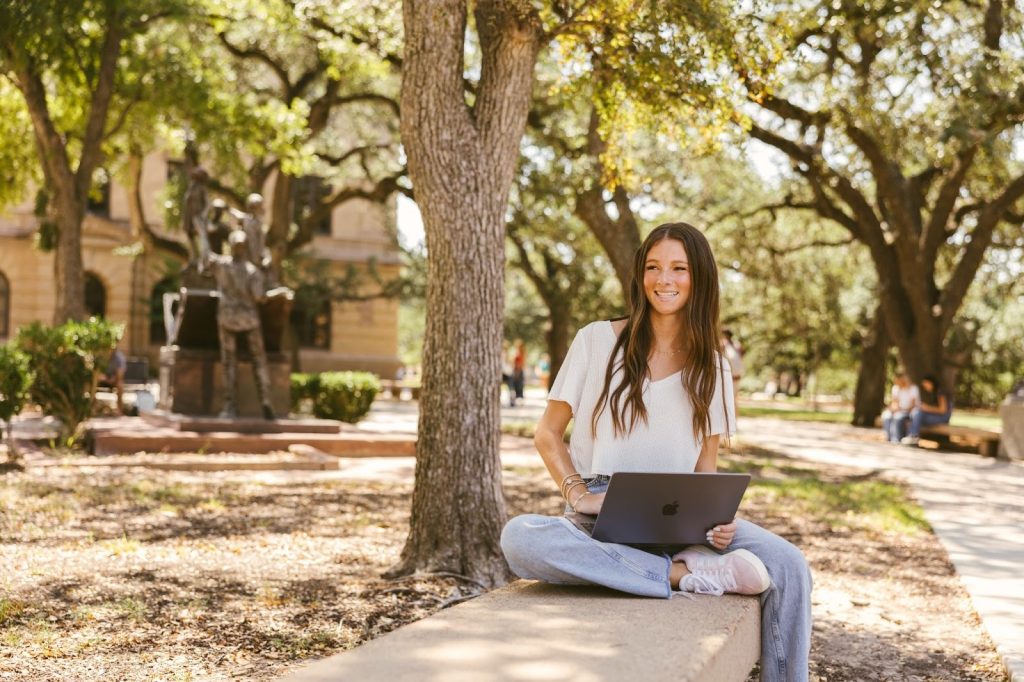 Texas A&M student on computer