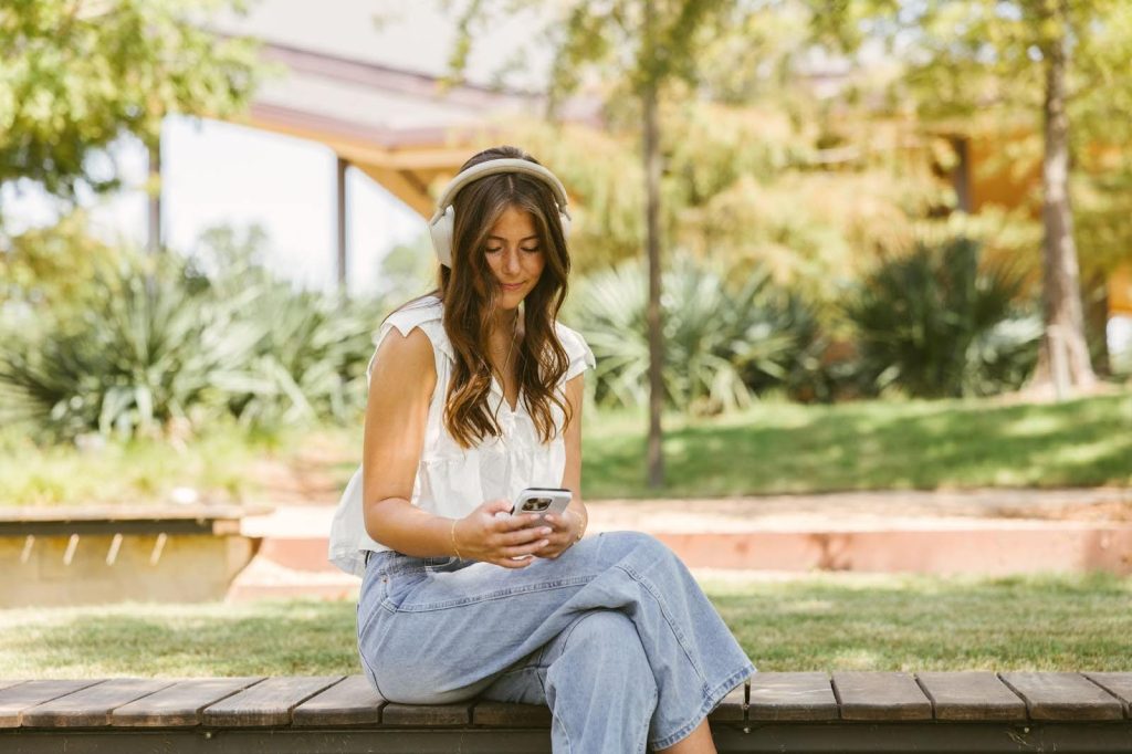 Texas A&M student on campus listening to music