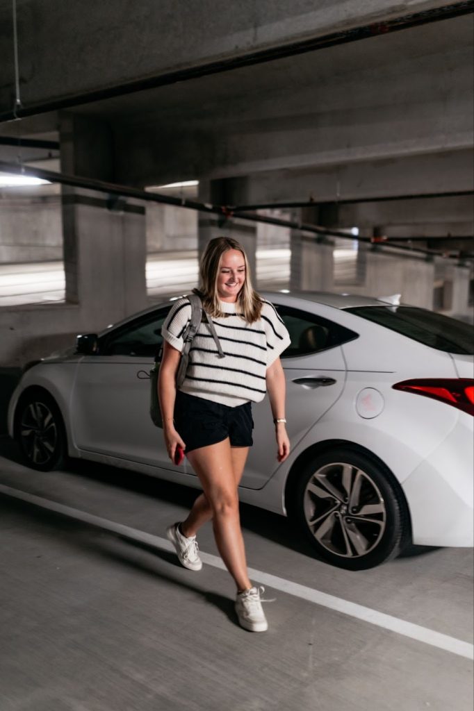 Texas A&M student walks in a parking garage in College Station.