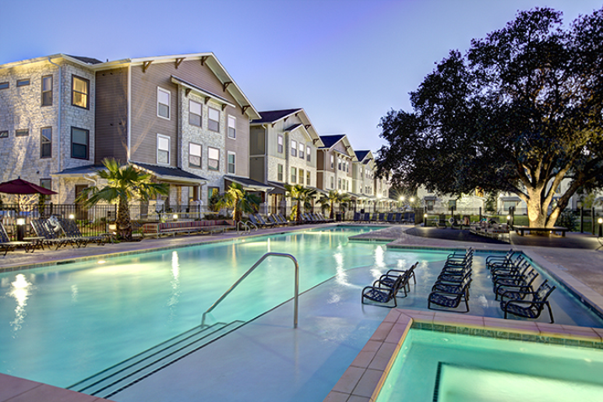 Pool and townhome view of UCentre Apartments in College Station.