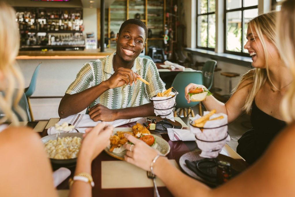 Texas A&M students enjoy a meal together at a local restaurant in College Station.