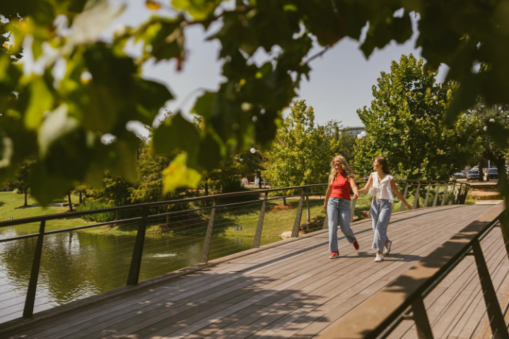 Texas A&M students walk through Aggie Park in College Station.