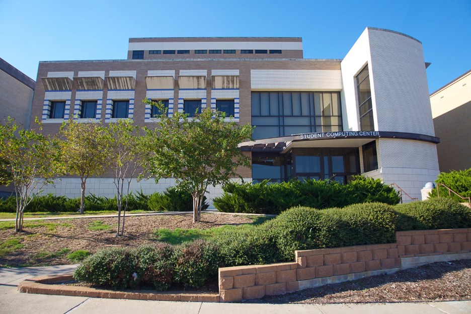 Sidewalk view of the Student Computing Center at Texas A&M on campus in College Station.