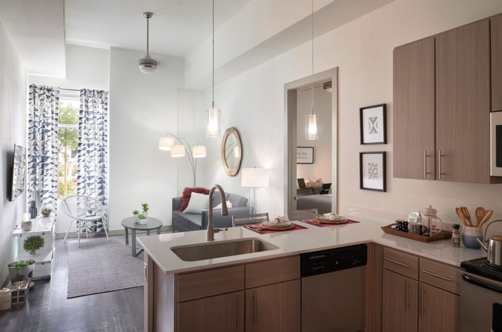 Kitchen and living area inside units at Ion College Station near Texas A&M.