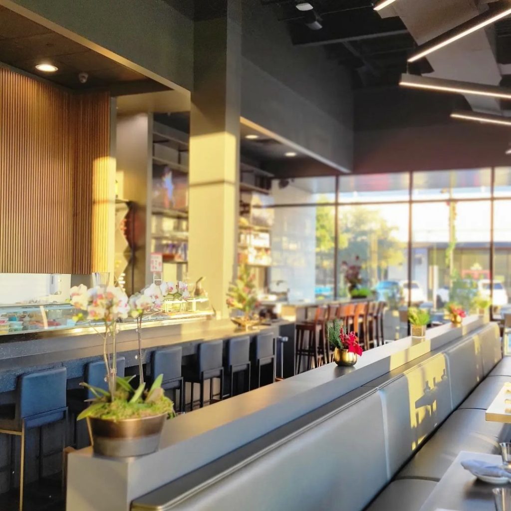 Modern booth and bar-style seating at Kanji Sushi in College Station.