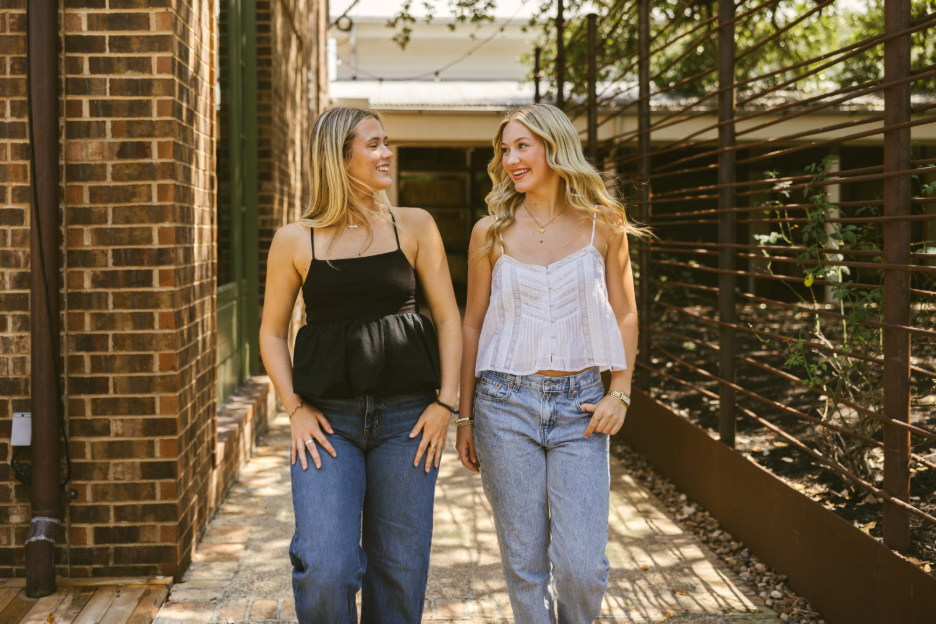 Two Texas A&M students walk on campus in College Station.