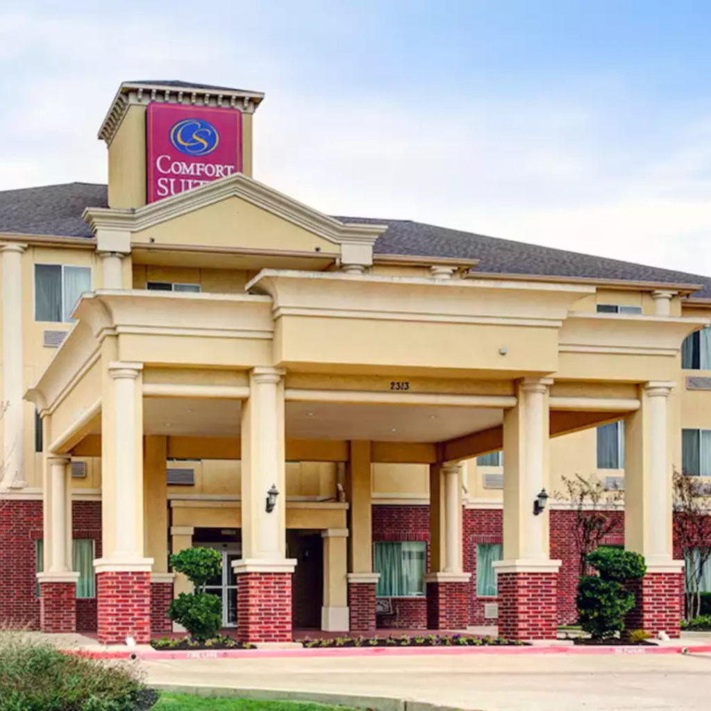 Comfort Suites Texas Avenue red brick and yellow stucco exterior.