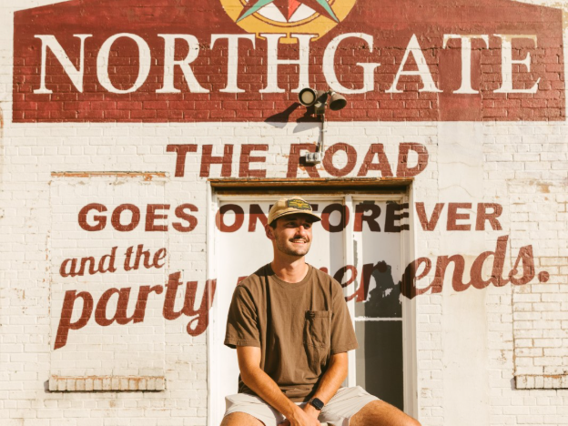 Student posing in Northgate near Texas A&M. 
