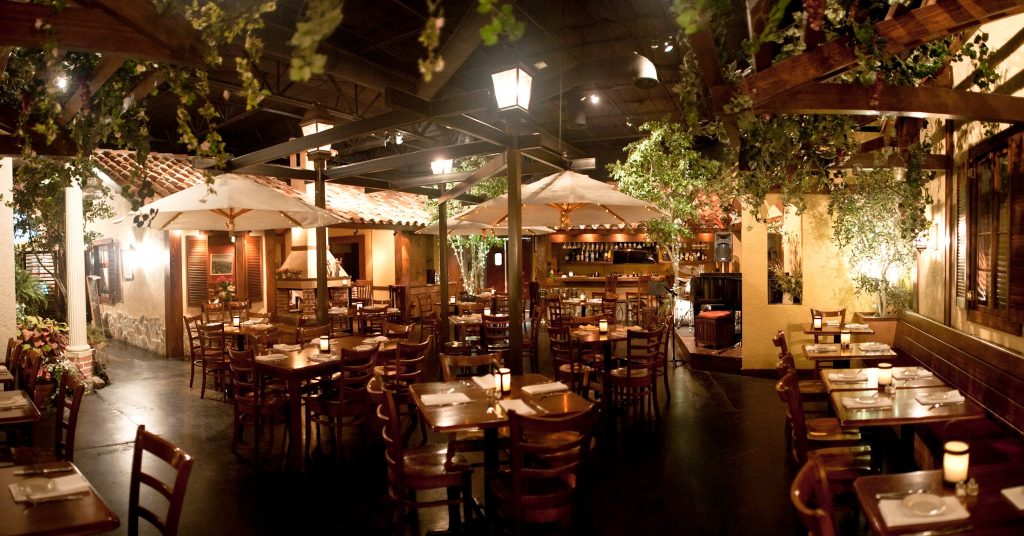 Luigi’s Patio Ristorante has draped greenery, wooden furniture and interior finishes that pull from Italian architecture.