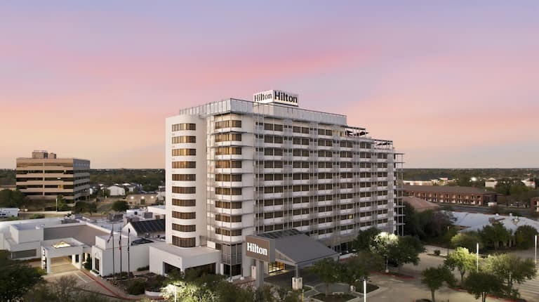 Birds-eye view of Hilton College Station & Conference Center at sunset near Texas A&M.