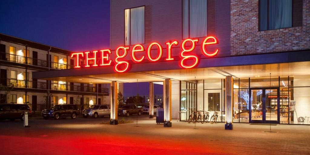 Neon “The George” sign located on the front exterior of the hotel in College Station. 