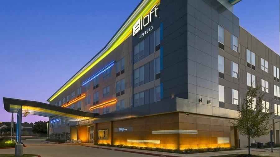 A look at the modern, well-lit exterior of Aloft College Station near Texas A&M.