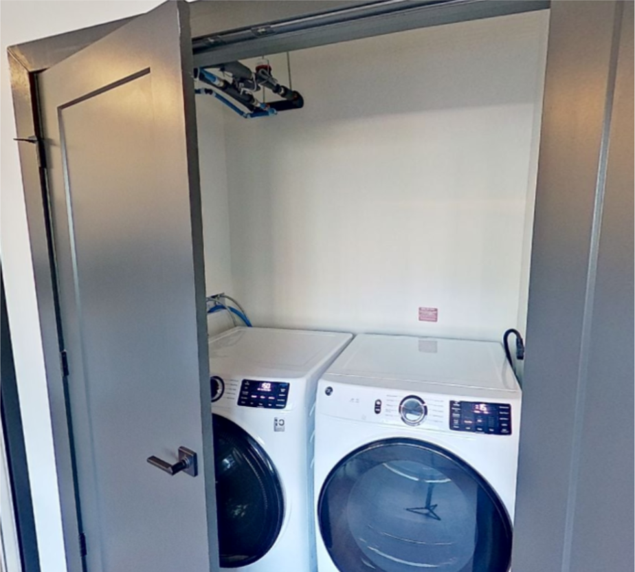 Example side-by-side washer and dryers that eliminates the need to reach high places when moving laundry.