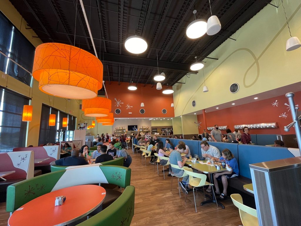 Colorful, retro interior of Snooze AM Eatery College Station.