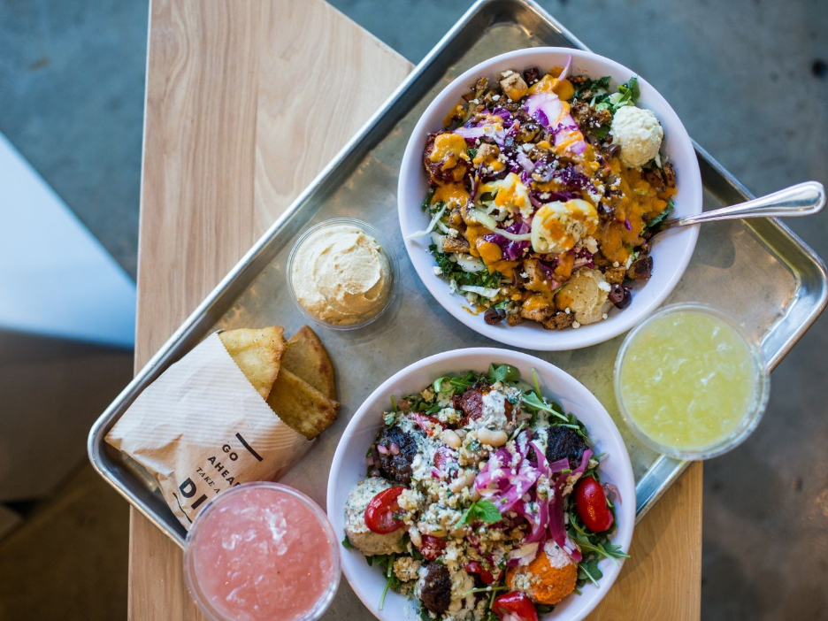 A Mediterranean grain bowl with vegetables, hummus and protein from CAVA in College Station.