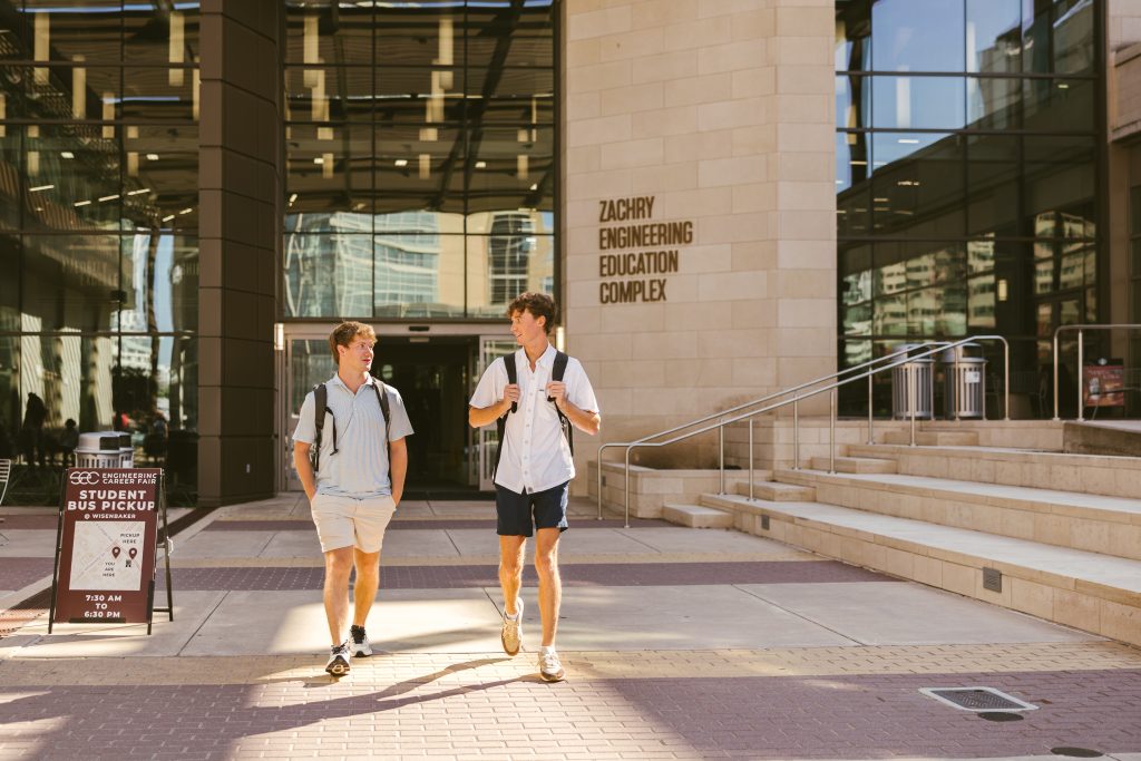 Two students on campus at TAMU near The Jay in College Station.